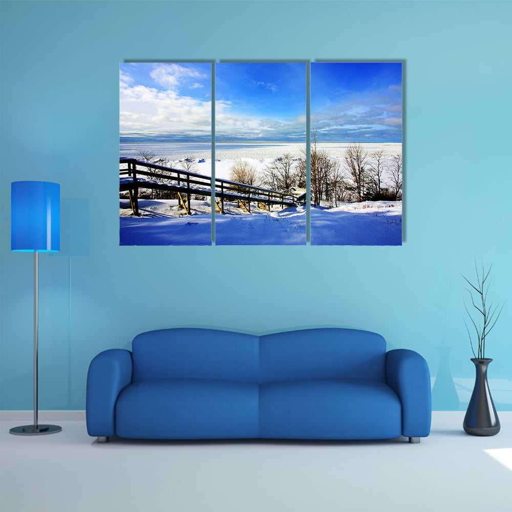 A beautiful winter scene at a lake multi panel canvas wall art
