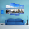 A beautiful winter scene at a lake multi panel canvas wall art