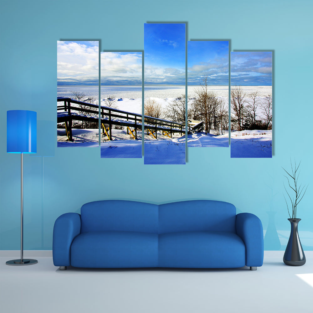 A beautiful winter scene at a lake multi panel canvas wall art