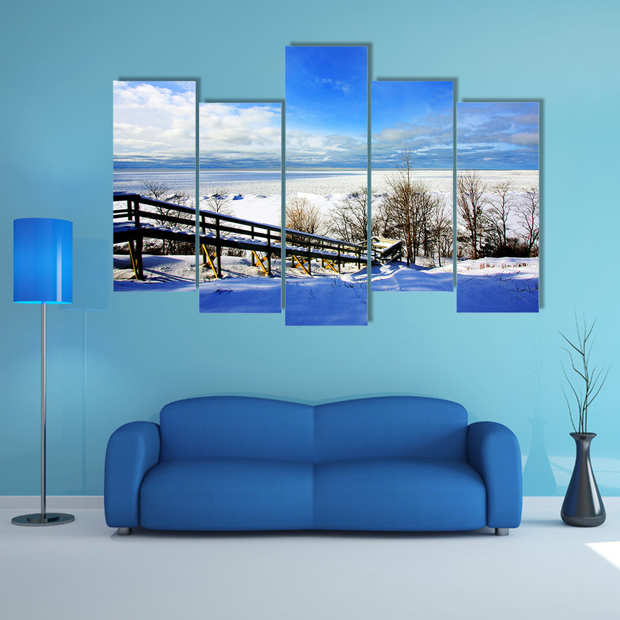 A beautiful winter scene at a lake multi panel canvas wall art