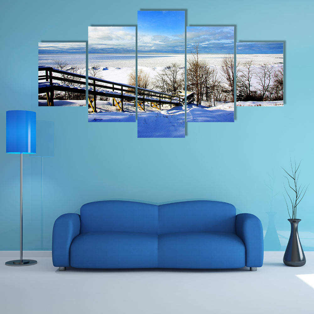 A beautiful winter scene at a lake multi panel canvas wall art
