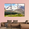 High mountains with ice field next to road with buses wall art