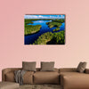 Aerial view of blue lakes and green forests  multi panel canvas wall art