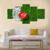 A Cricket ball on a grass next to the white line Multi Multi Panel Canvas Wall art