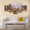 A landscape scene of a grizzly bear in the Rocky Mountains Multi Panel Canvas Wall Art