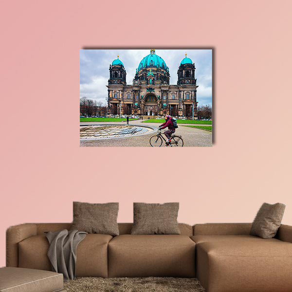 Man riding a bicycle at Berliner Dom Cathedral in Berlin on Mitte Island, wall art
