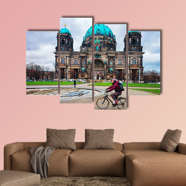 Man riding a bicycle at Berliner Dom Cathedral in Berlin on Mitte Island, wall art