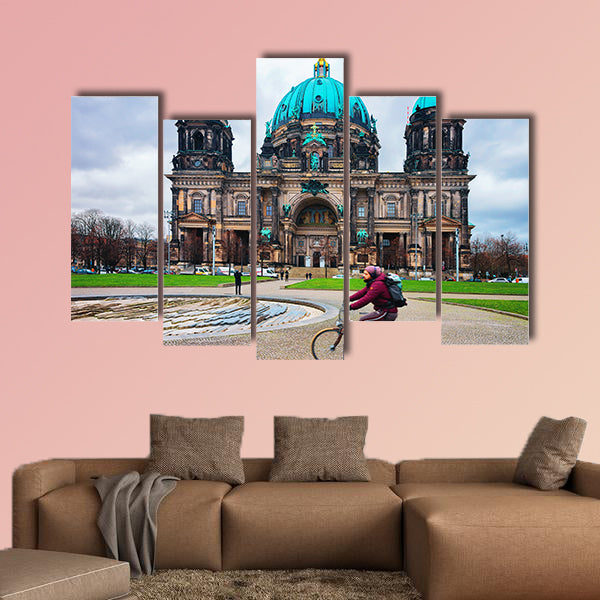 Man riding a bicycle at Berliner Dom Cathedral in Berlin on Mitte Island, wall art
