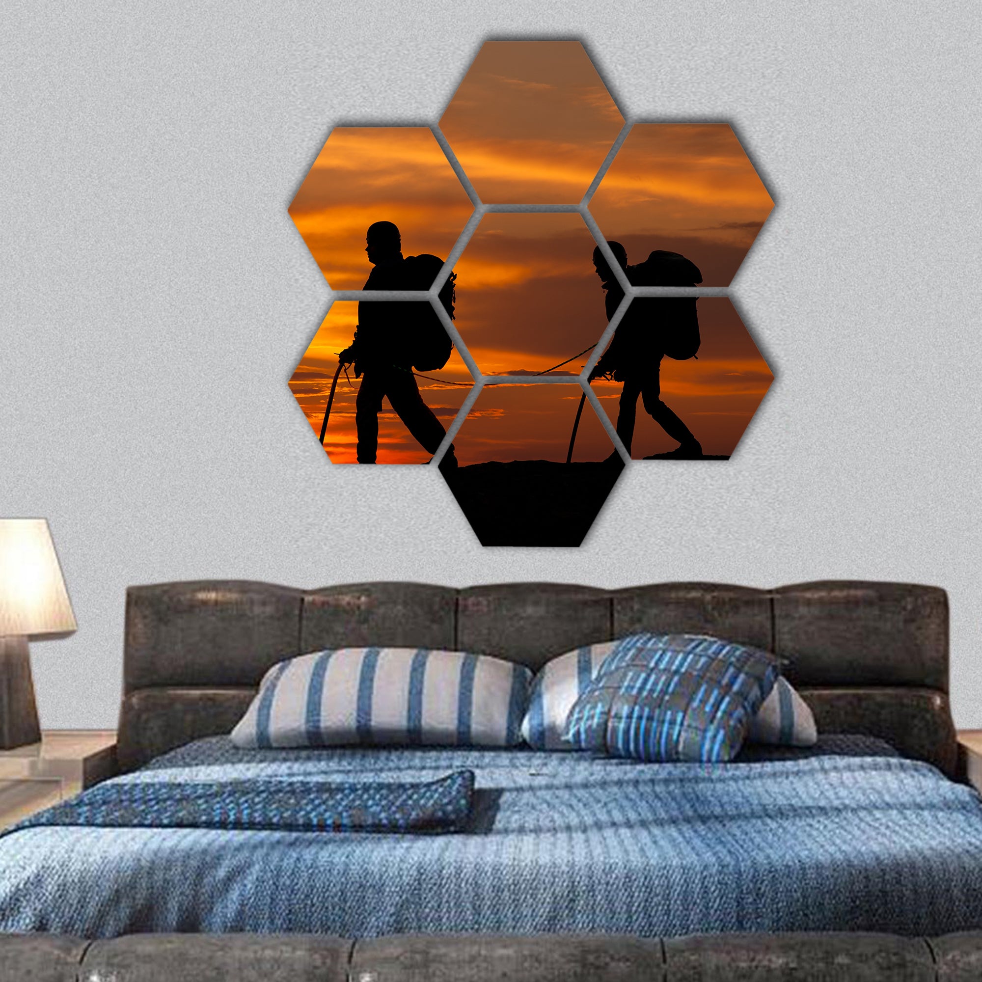 silhouette of two walking rock climbers on sunset sky hexagonal canvas wall art