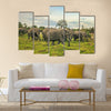 African elephants with baby on the masai mara kenya Africa Multi Panel Canvas Wall art