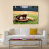 Old baseball, glove, and bat on field with base and outfield in background Multi panel canvas wall art