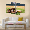 Old baseball, glove, and bat on field with base and outfield in background Multi panel canvas wall art