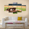 Old baseball, glove, and bat on field with base and outfield in background Multi panel canvas wall art