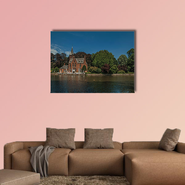Amazing lake surrounded by greenery and old brick building multi panel canvas wall art