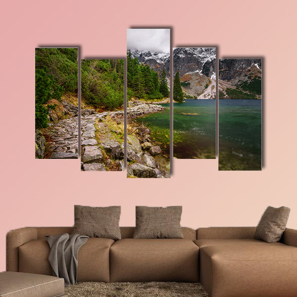 Rocky road along the shore of a mountain lake in High Tatras in autumn