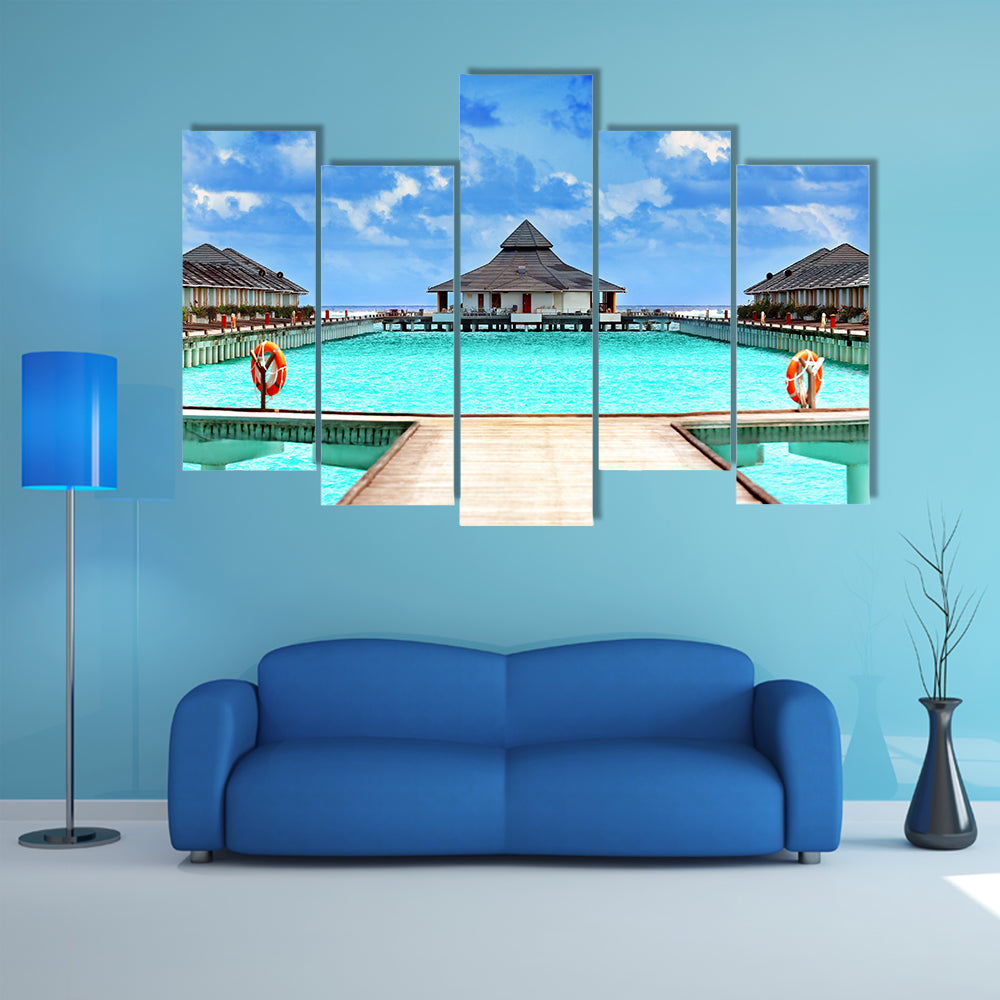 The Wooden pontoon and modern beach houses Multi Panel Canvas Wall Art