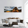 Quiet church by a glacier lake against a mountain backdrop panoramic canvas wall art