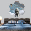 Astronaut stands in surreal white desert hexagonal canvas wall art