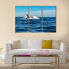 Humpback whale breaching on pacific ocean background Multi panel canvas wall art