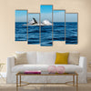 Humpback whale breaching on pacific ocean background Multi panel canvas wall art