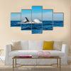 Humpback whale breaching on pacific ocean background Multi panel canvas wall art