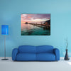 A beautiful, colorful sunset over the ocean, Maldives multi panel canvas wall art