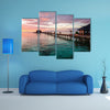 A beautiful, colorful sunset over the ocean, Maldives multi panel canvas wall art