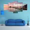 A beautiful, colorful sunset over the ocean, Maldives multi panel canvas wall art