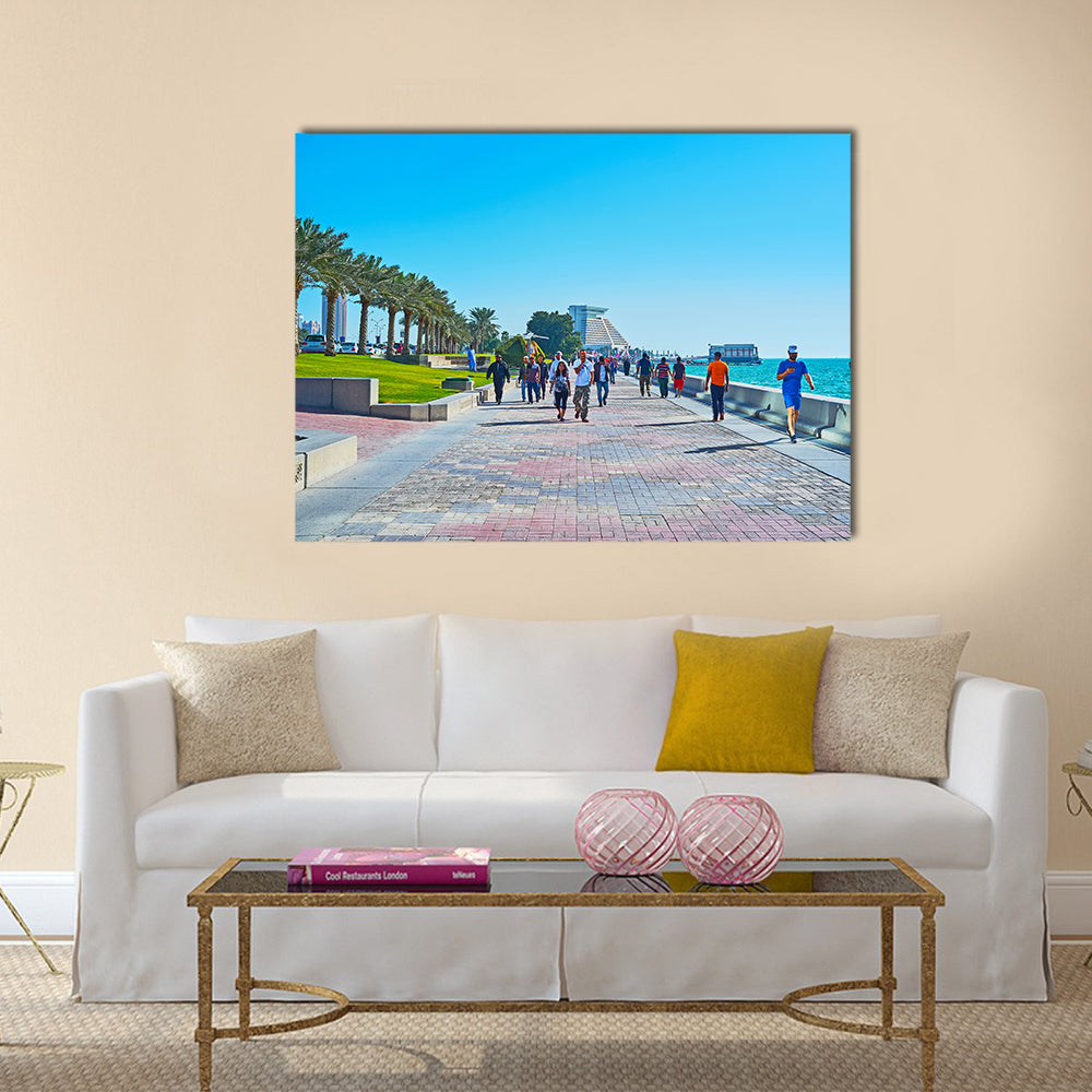 The crowded promenade in West Bay neighborhood with modern building of Sheraton grand Resort on background Multi panel canvas wall art