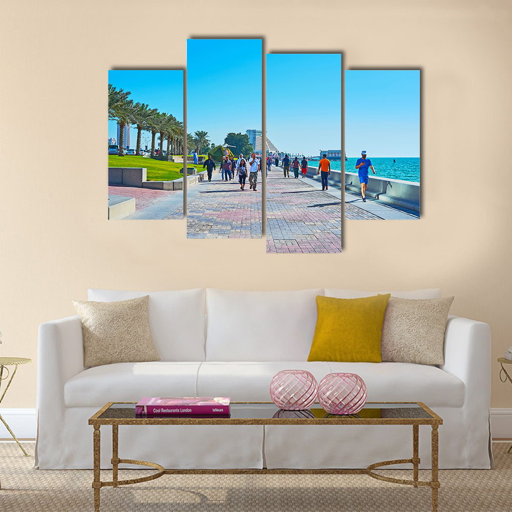 The crowded promenade in West Bay neighborhood with modern building of Sheraton grand Resort on background Multi panel canvas wall art