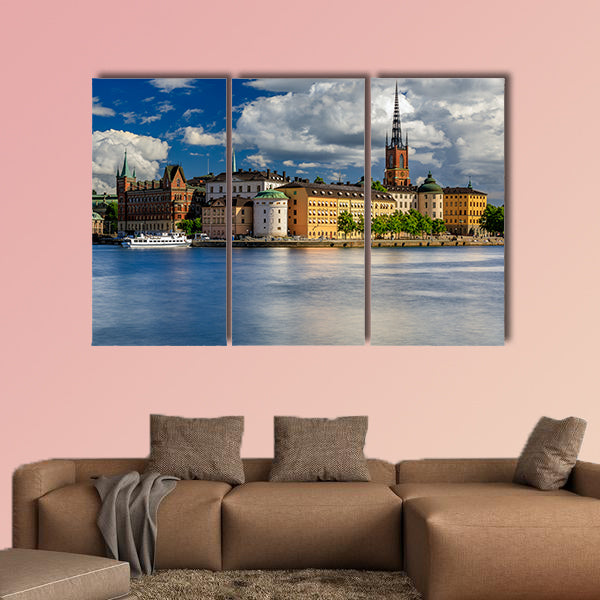Tourist ferry on Lake Malaren with traditional gothic buildings wall art