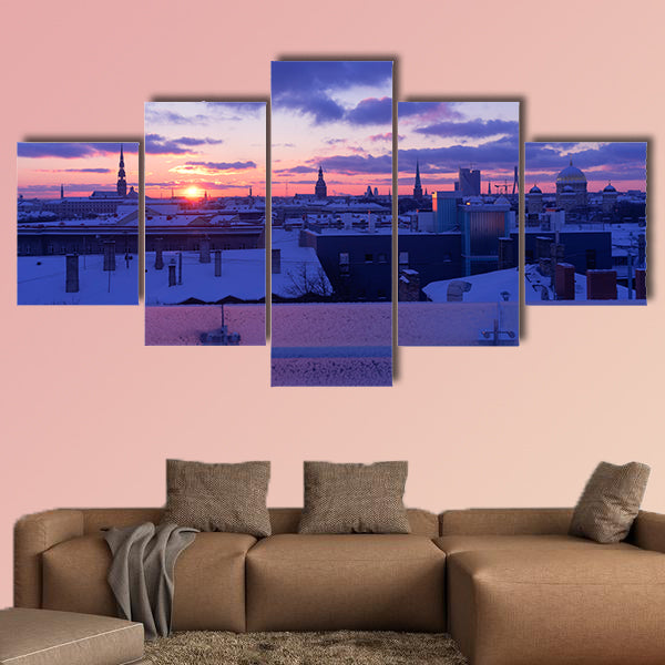Sunset in purple tones of the city of Riga in winter multi panel canvas wall art