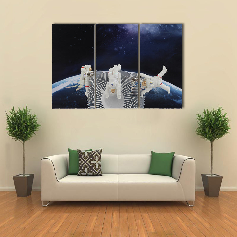 Astronauts In The Zero Gravity Multi Panel Canvas Wall Art