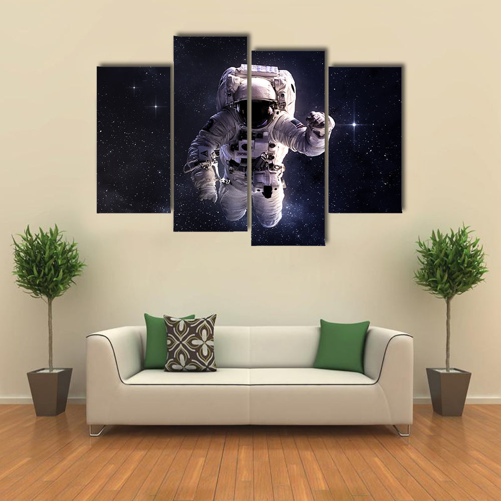 Astronaut Wandering In Outer Space Multi Panel Canvas Wall Art