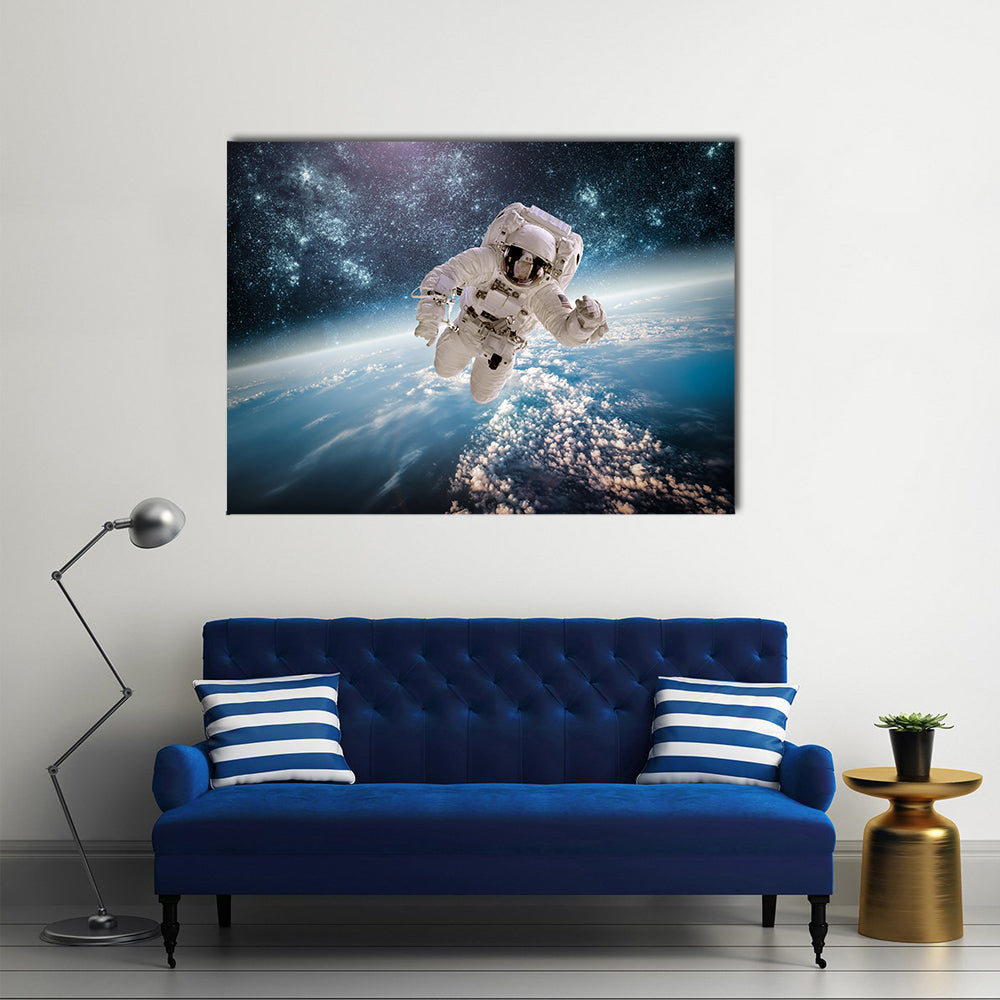 Astronaut In Outer Space Near The Back Drop Of Earth Multi Panel Canvas Wall Art