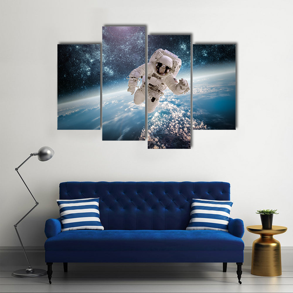 Astronaut In Outer Space Near The Back Drop Of Earth Multi Panel Canvas Wall Art