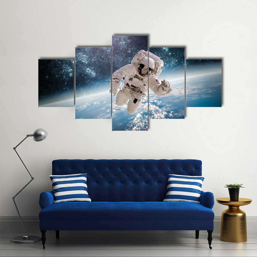 Astronaut In Outer Space Near The Back Drop Of Earth Multi Panel Canvas Wall Art