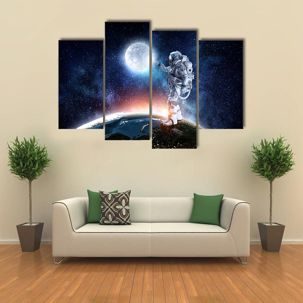 Astronaut Pointing The Moon For A Candid Click Multi Panel Canvas Wall Art