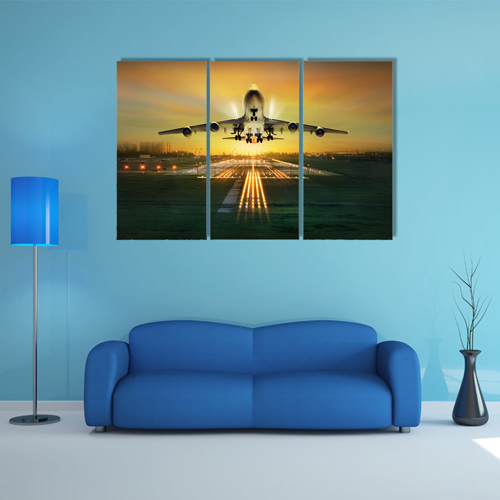 A Lit View Of Passenger Plane During Takeoff From Runway Multi Panel Canvas Wall Art
