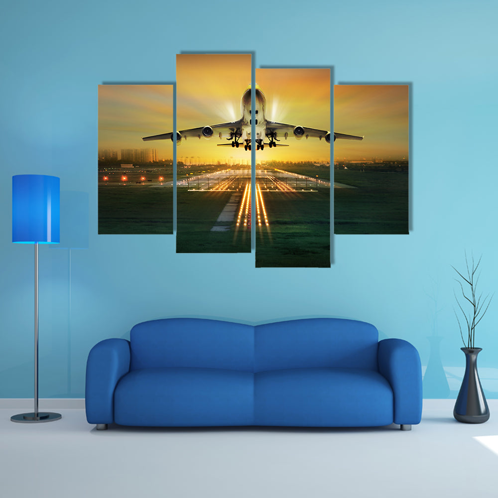 A Lit View Of Passenger Plane During Takeoff From Runway Multi Panel Canvas Wall Art