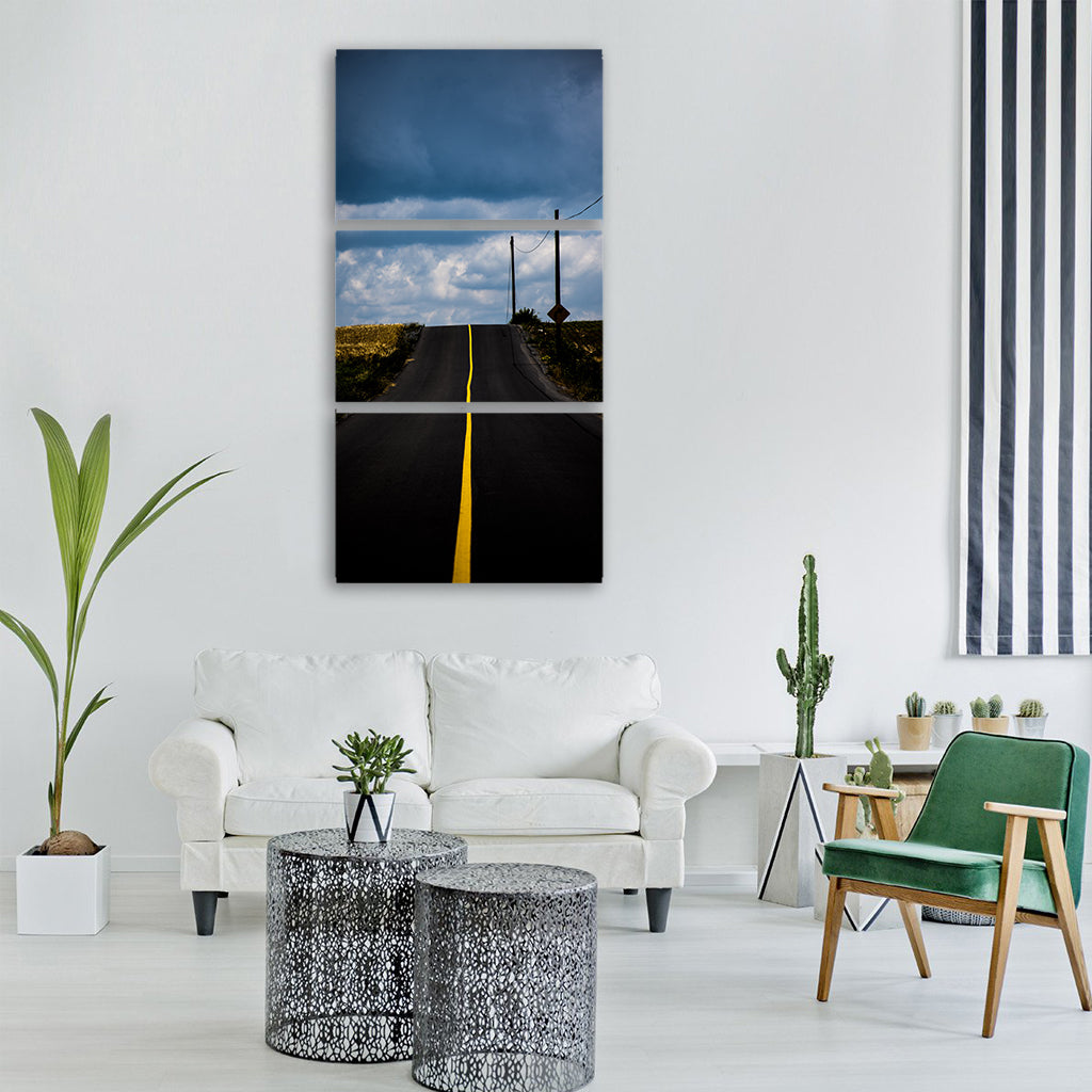 road line yellow cloudy country Vertical Canvas Wall Art