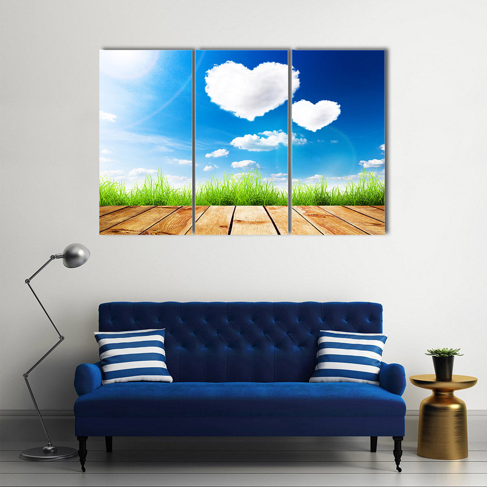 Green Grass Along The Wooden Plank Under The Blue Sky With Hearty Clouds Multi Panel Canvas Wall Art