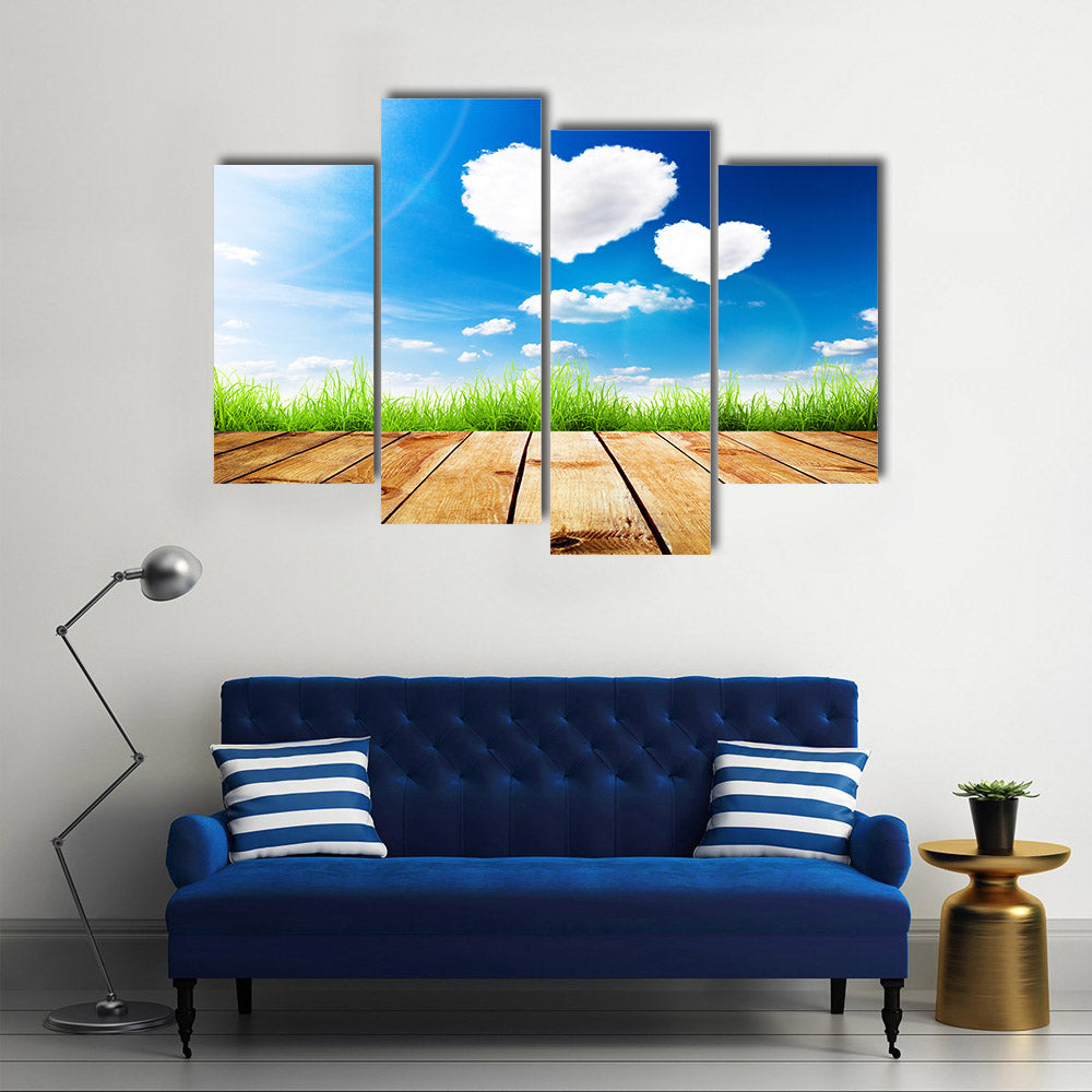 Green Grass Along The Wooden Plank Under The Blue Sky With Hearty Clouds Multi Panel Canvas Wall Art