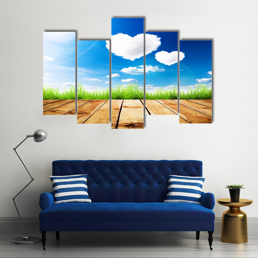 Green Grass Along The Wooden Plank Under The Blue Sky With Hearty Clouds Multi Panel Canvas Wall Art