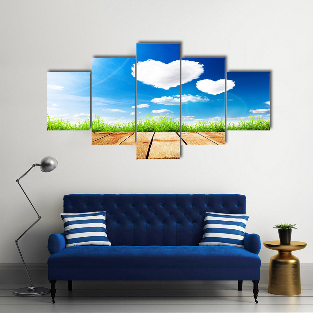 Green Grass Along The Wooden Plank Under The Blue Sky With Hearty Clouds Multi Panel Canvas Wall Art
